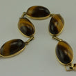 Laden Sie das Bild in den Galerie-Viewer, Vintage Armband mit Tigerauge / 375er - 9 Karat Gelbgold / ca. 19,5 cm
