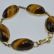 Laden Sie das Bild in den Galerie-Viewer, Vintage Armband mit Tigerauge / 375er - 9 Karat Gelbgold / ca. 19,5 cm
