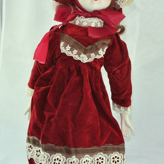 Puppe mit Rotem Kleid / Porzellankopf & Stoffkörper / ca. 47 cm