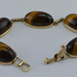 Laden Sie das Bild in den Galerie-Viewer, Vintage Armband mit Tigerauge / 375er - 9 Karat Gelbgold / ca. 19,5 cm
